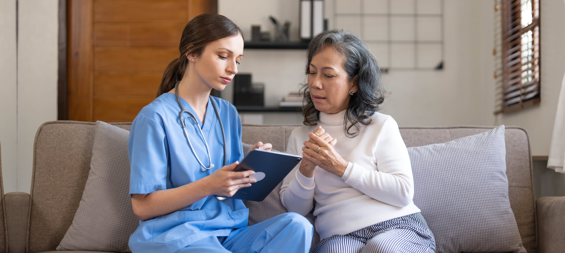 doctor talk to elderly woman