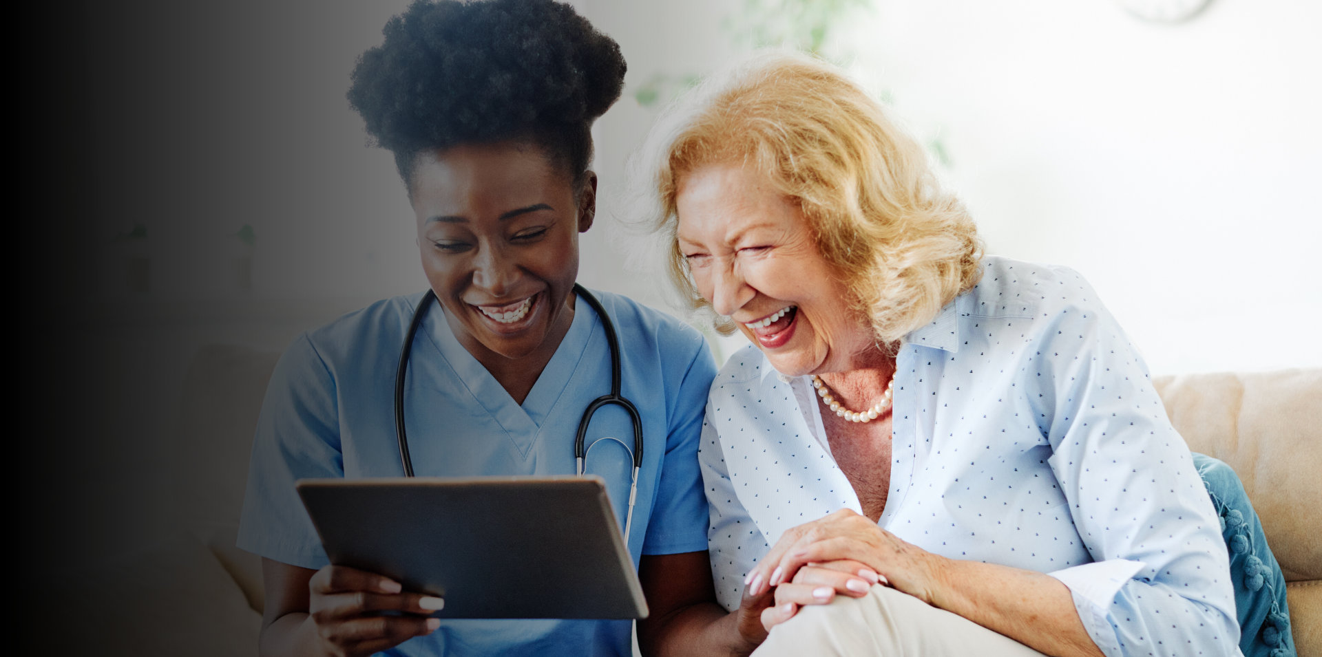 male nurse explaining to elderly man